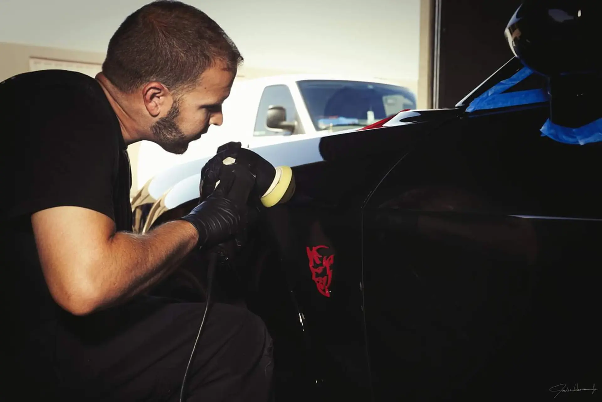 black challenger applying ceramic coating wash doc auto detailing haltom tx